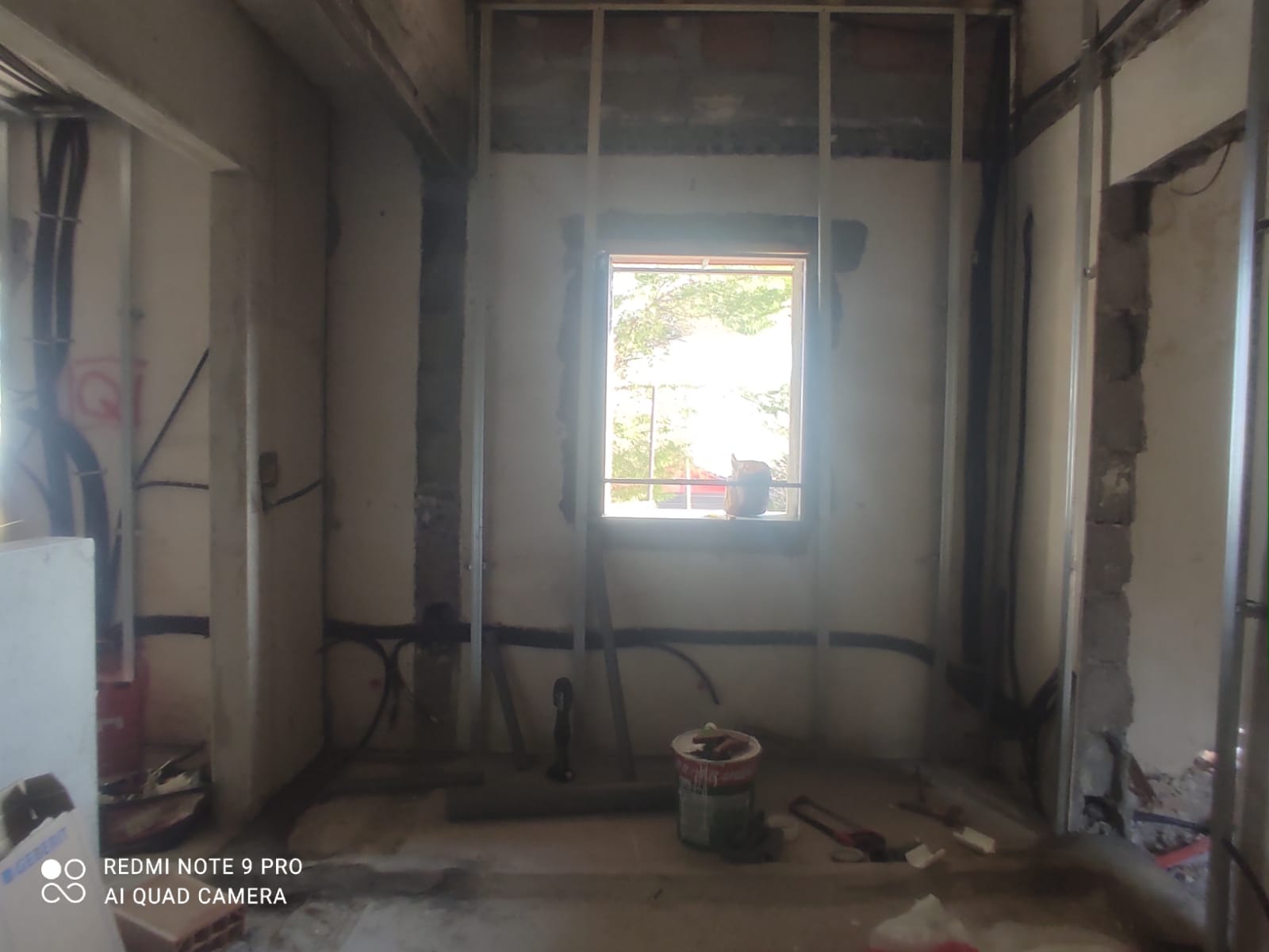 The main room stripped back to bare walls and steel studs during the rebuild